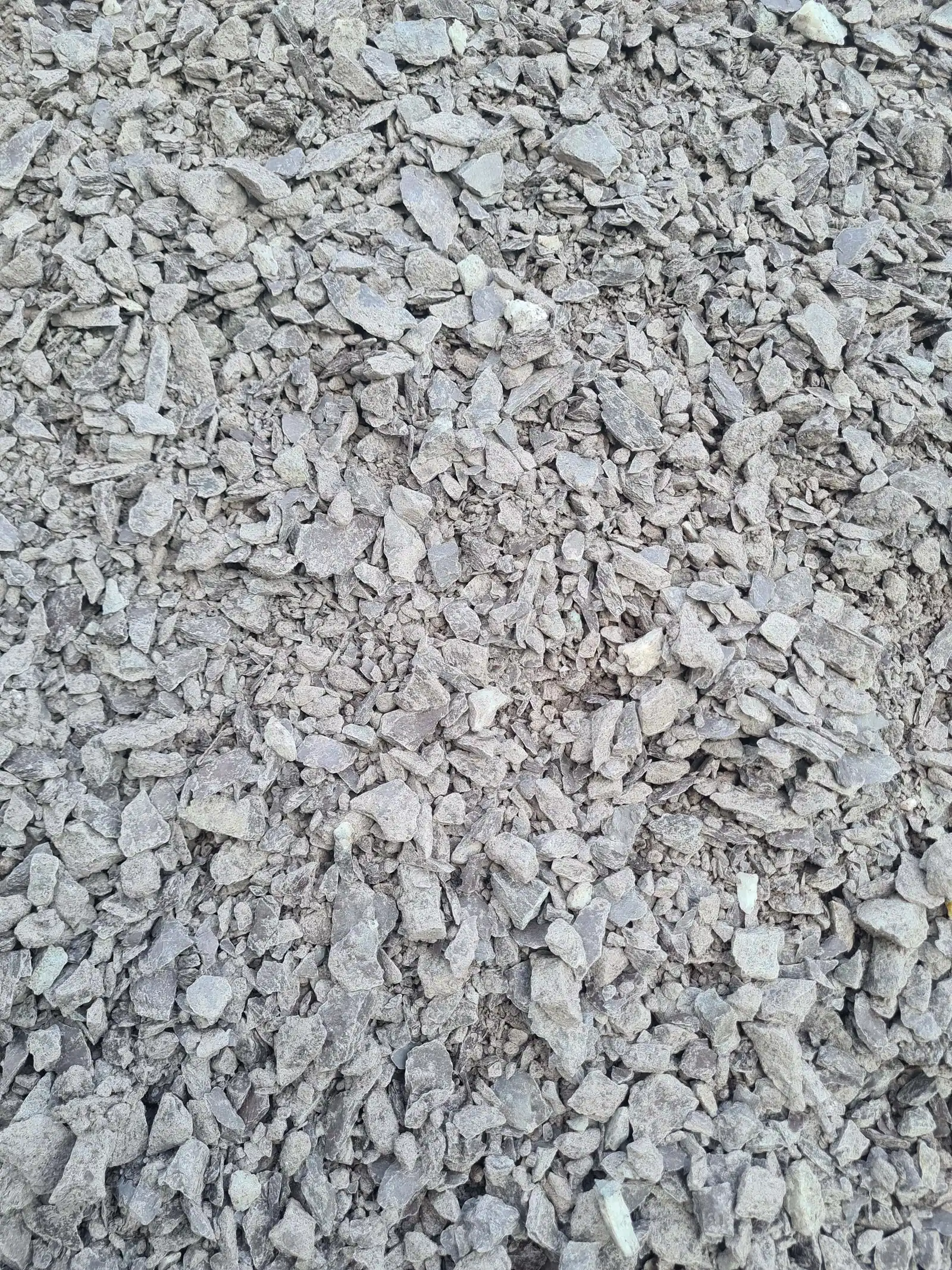 Hardcore three-quarter down, crushed grey stone base material