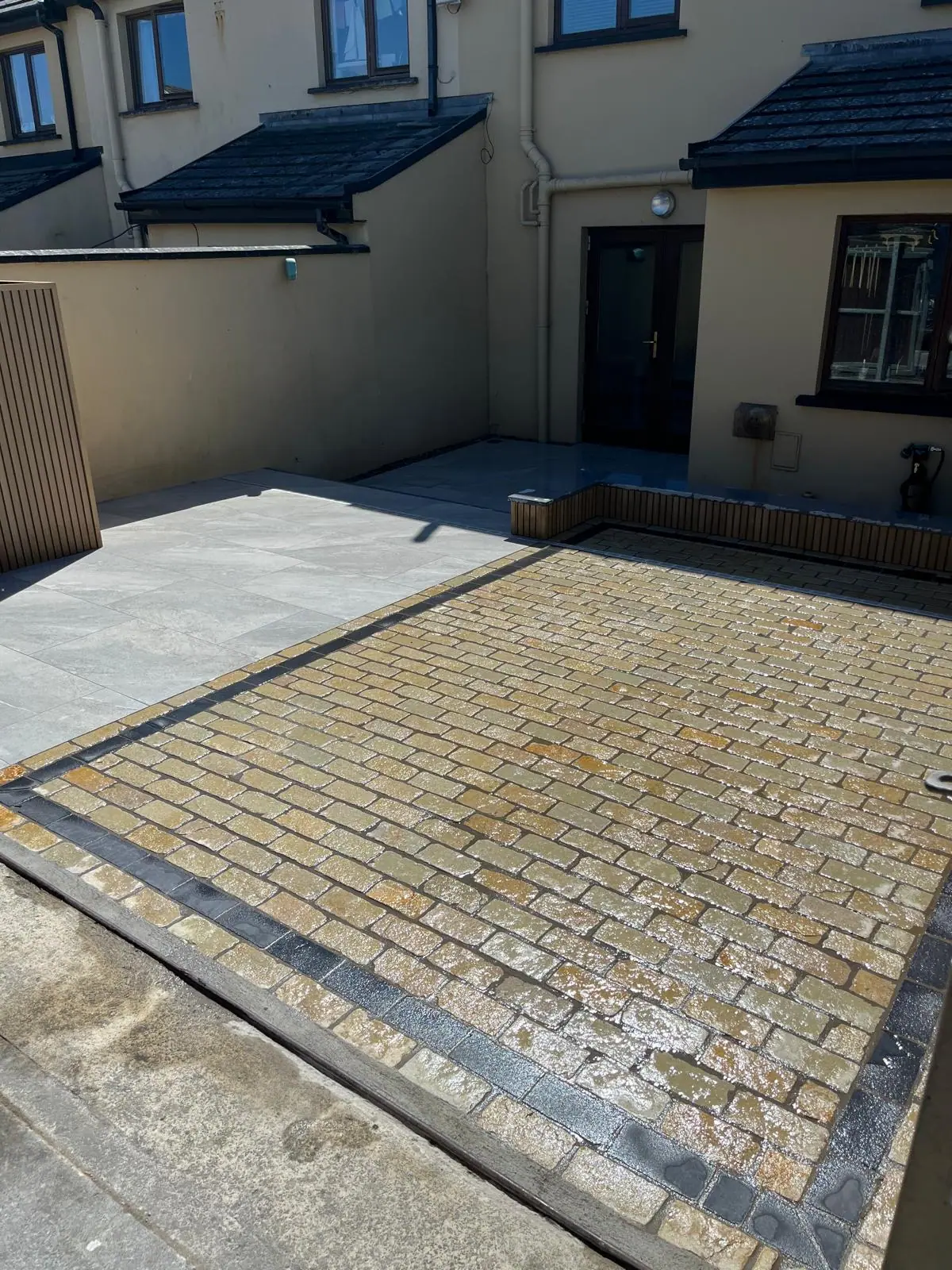 Stone sett driveway leading to the front of a house