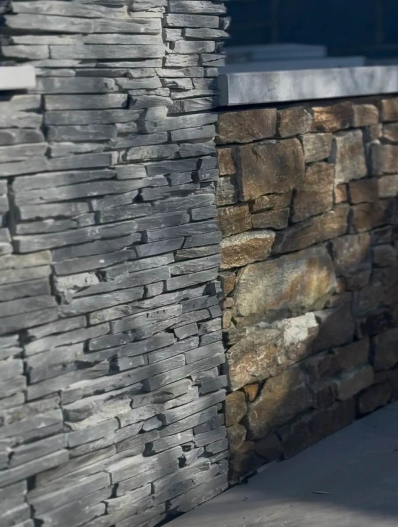 Two stone cladding colours side by side on a display wall