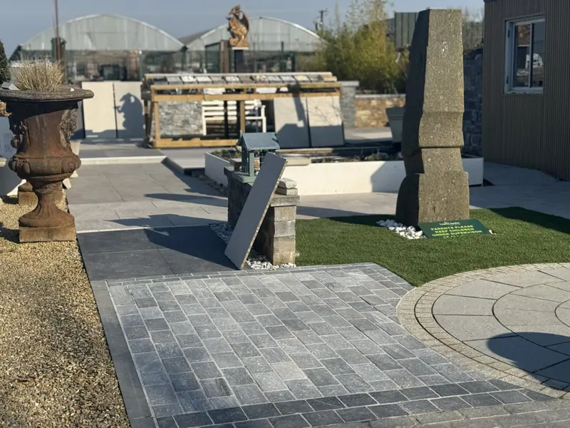 Display garden with paving and pier capstones at Creative Gardens