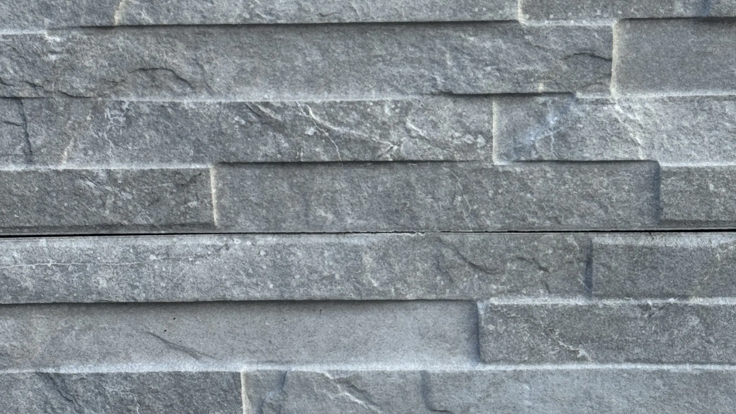 Grey ledgestone cladding panel close-up