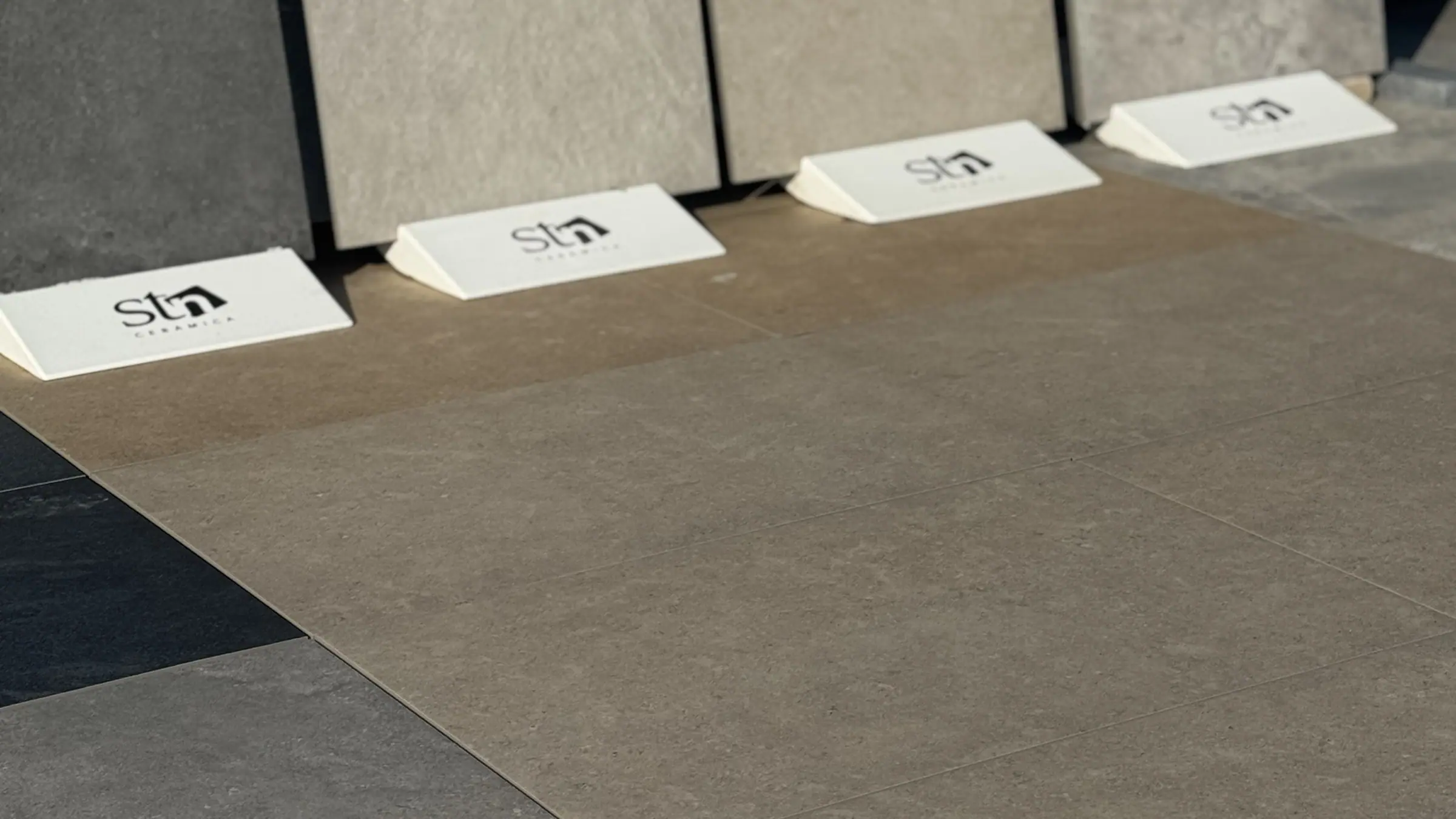 Outdoor porcelain tile display boards laid out in the Creative Gardens yard