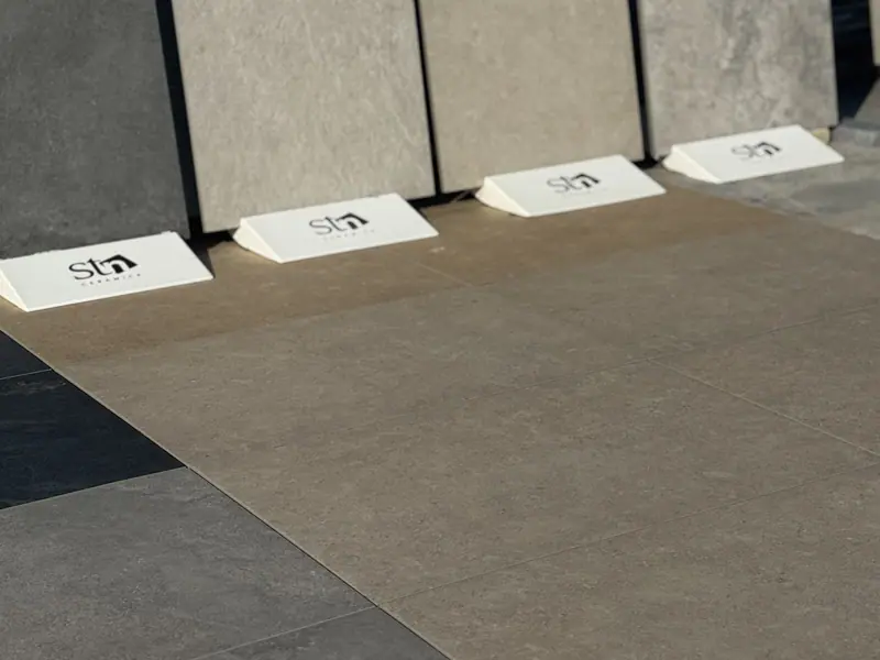 Outdoor porcelain tile display boards laid out in the Creative Gardens yard