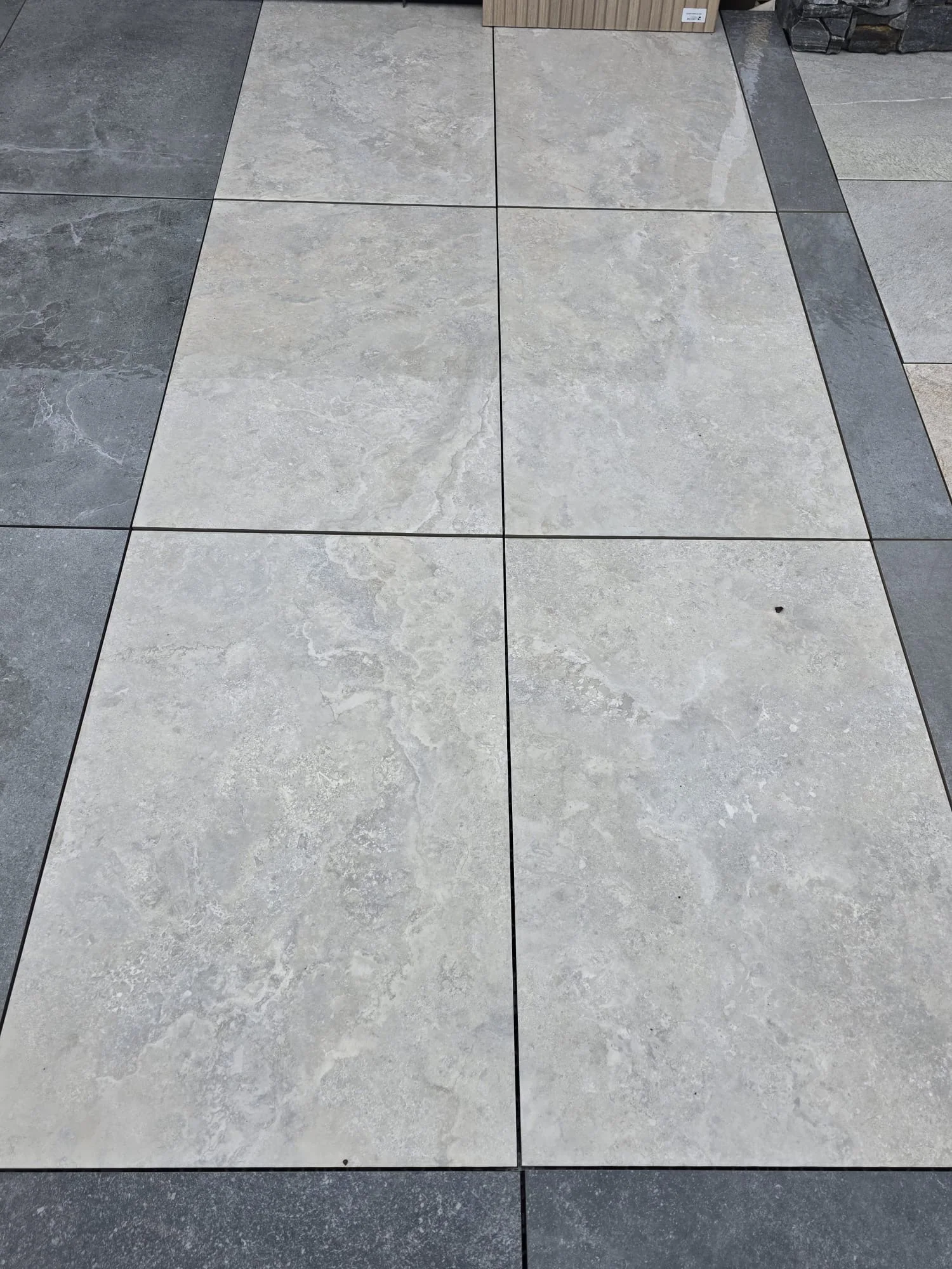 Chateau Greige porcelain paving laid in a display, soft grey-beige with subtle veining