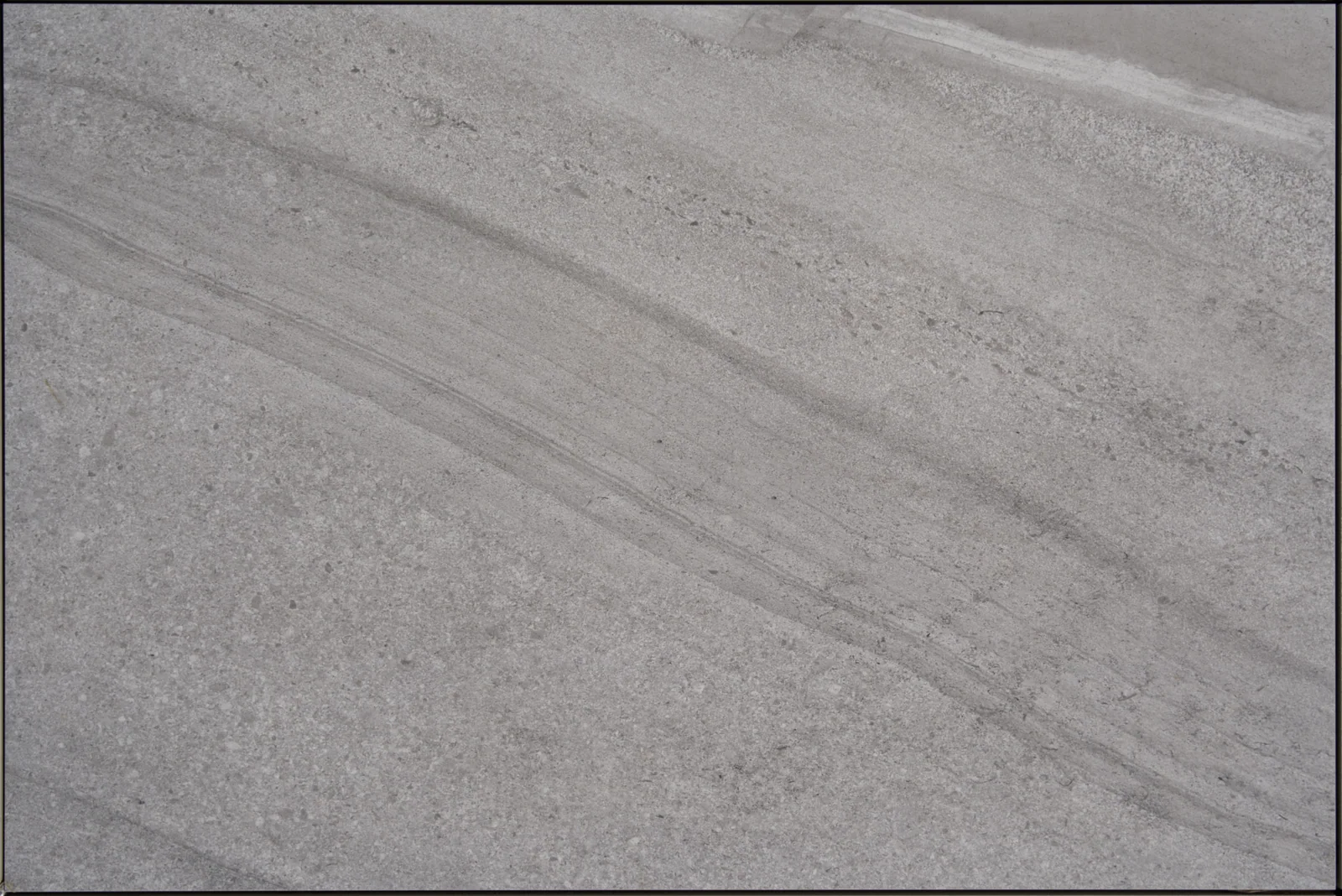 Cutstone Smoke outdoor porcelain tile, smoky grey with linear veining