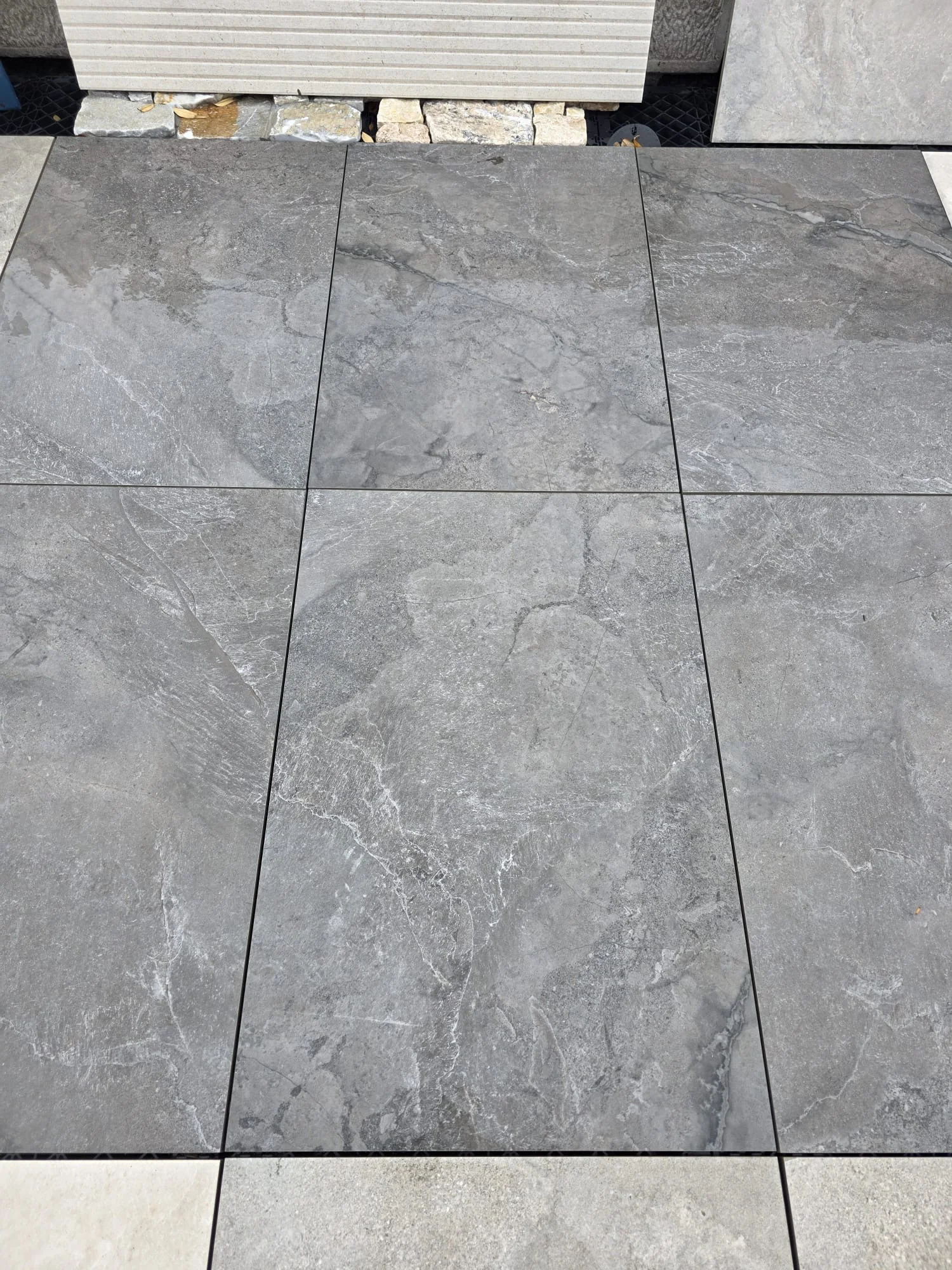 Slate Mix Mocha porcelain paving laid in a display, warm mocha slate effect