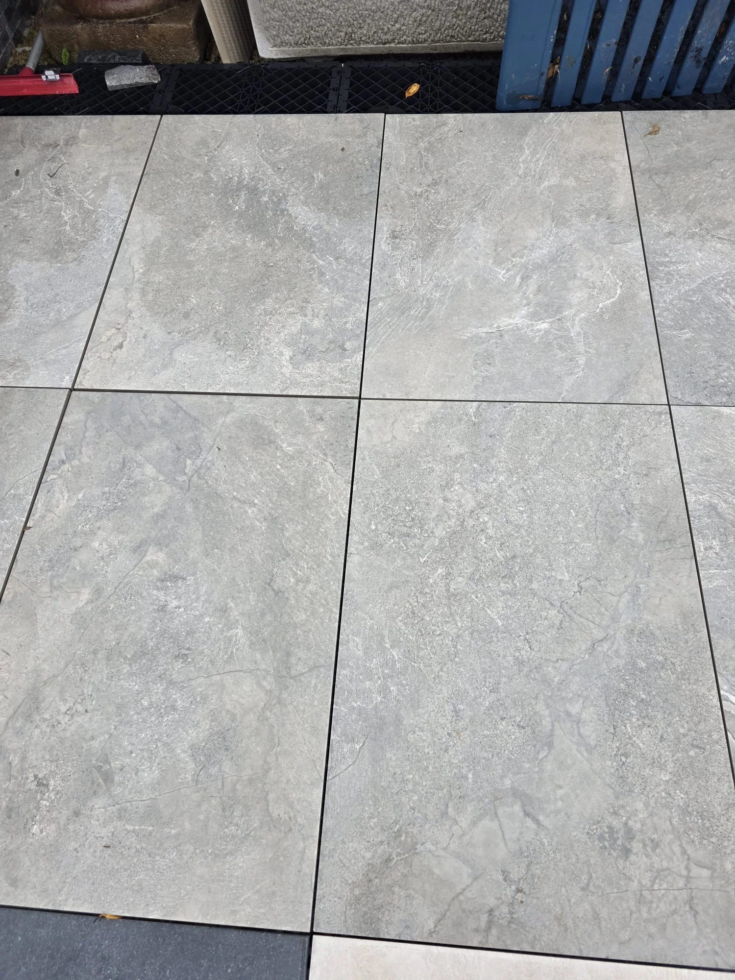 Slate Mix Natural porcelain paving laid in a display, grey slate effect