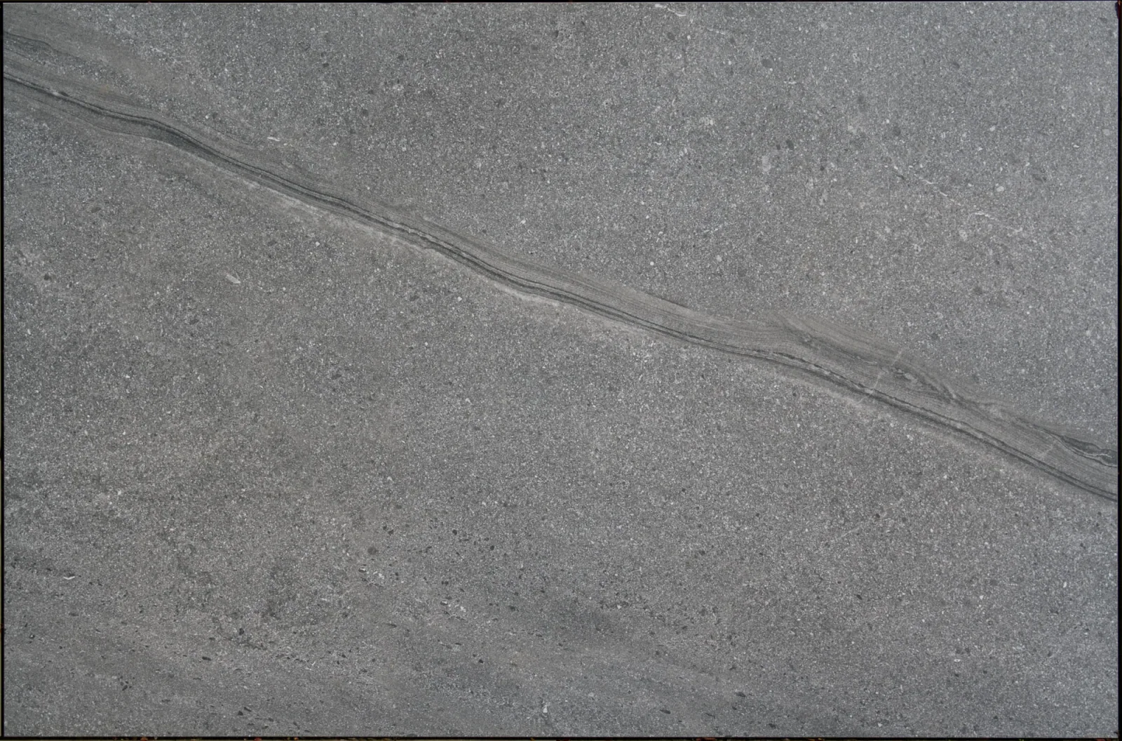 Outdoor porcelain tile, grey stone effect with a diagonal vein — product name to be confirmed
