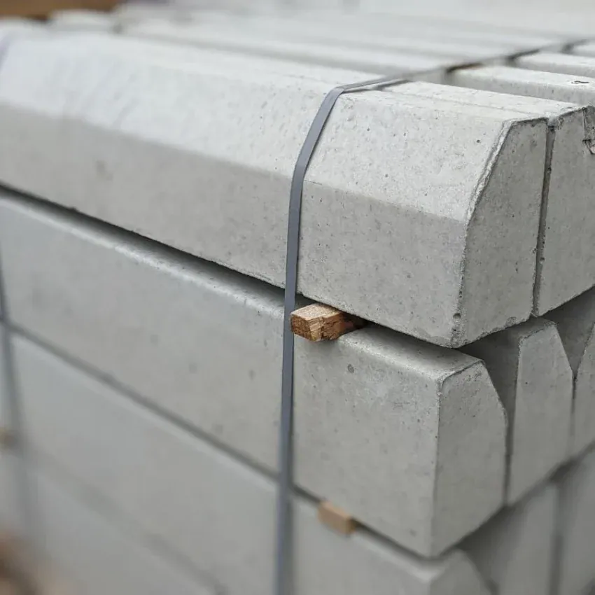 Precast concrete kerbing units stacked and strapped for delivery
