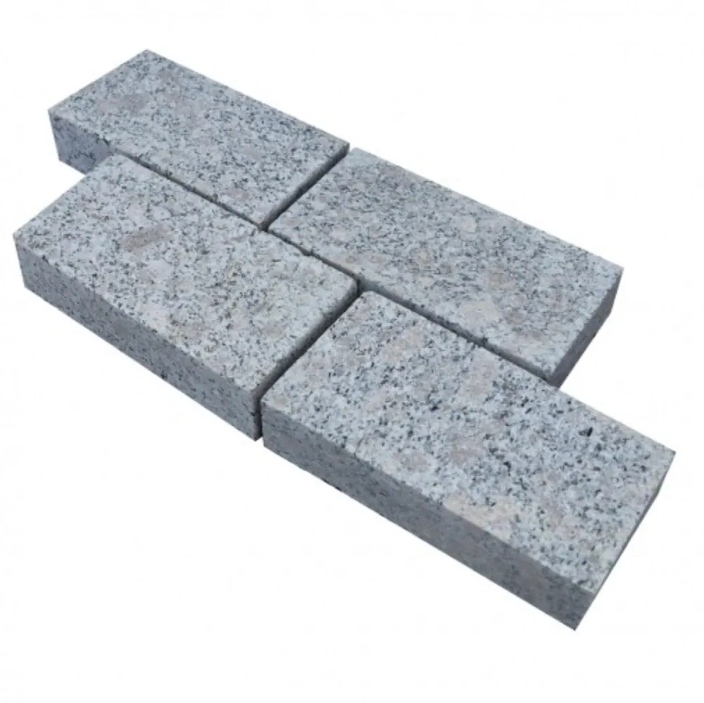 Silver Granite setts, light grey speckled granite blocks laid in a running pattern